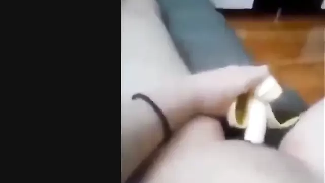 Asian babe inserts a banana into her vagina